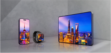 A smartphone, smartwatch, and tablet sit side-by-side on a gray background, all three displaying colorful nighttime photos on OLED displays. 