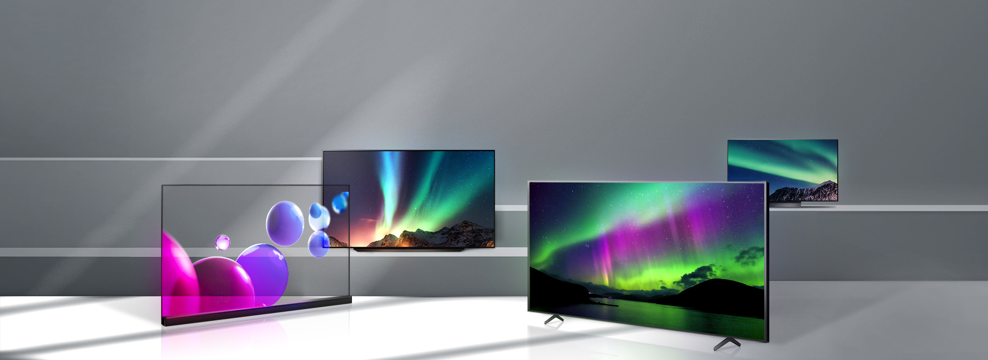 계단에 LG display의 OLED 패널이 사용된 TV 여러 대가 놓여있고, 화면에는 다채로운 색감의 그래픽 이미지가 떠 있다.